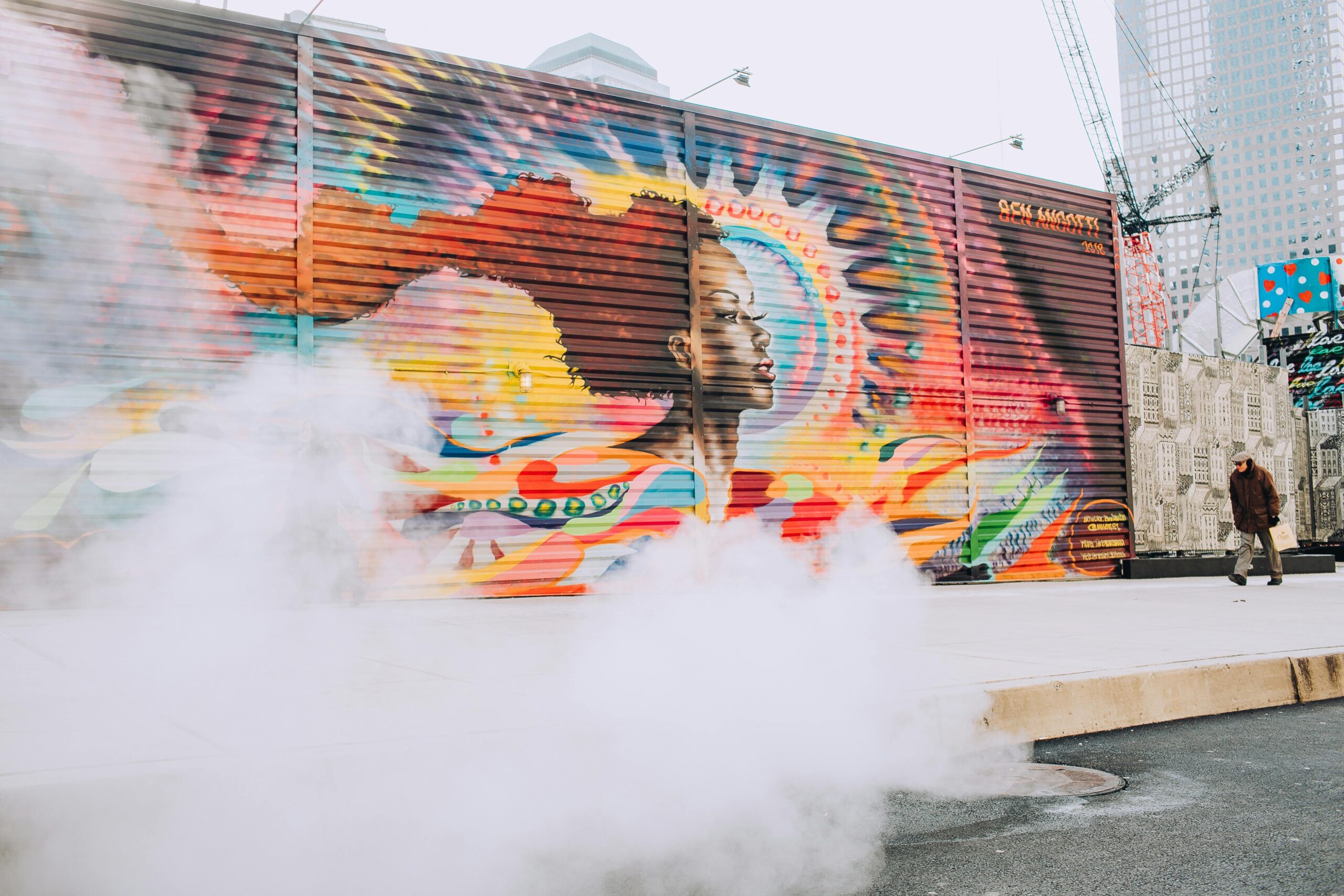 Dynamic street art mural in New York City with vibrant colors and urban atmosphere.